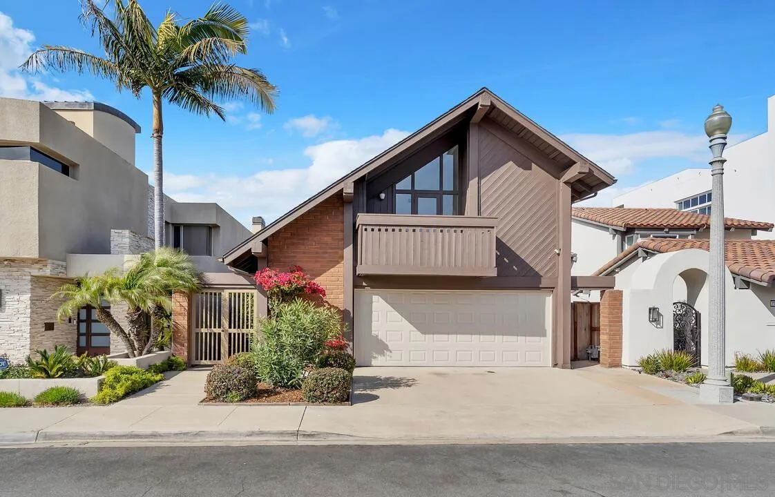 29 Green Turtle Road Coronado, CA 92118 - Photo 4 of 68 a front view of a house with a yard and garage