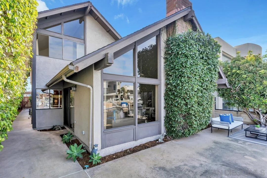 29 Green Turtle Road Coronado, CA 92118 - Photo 6 of 68 a view of a house with a yard and potted plants
