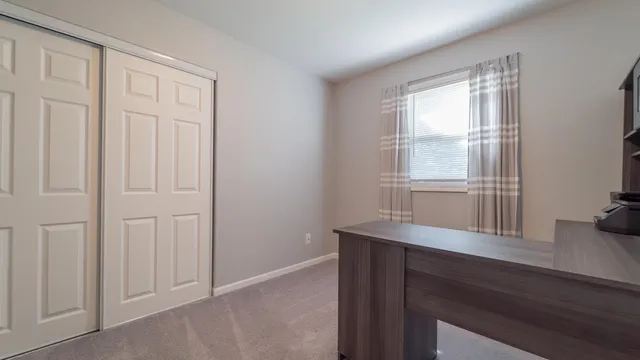 a room with a window and wooden floor