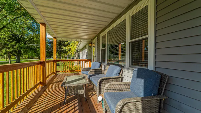 a balcony view with a seating space