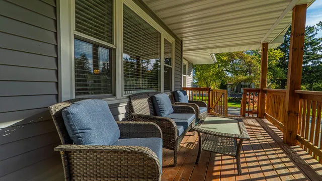 a view of a house with a tree in the background
