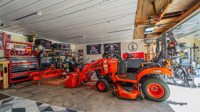 a front view of a house with a garden and trees
