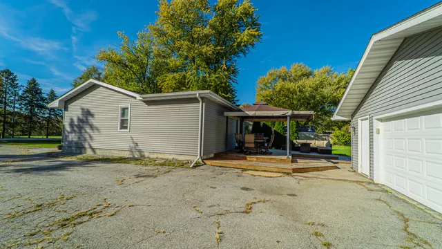 a view of outdoor space with deck and trees