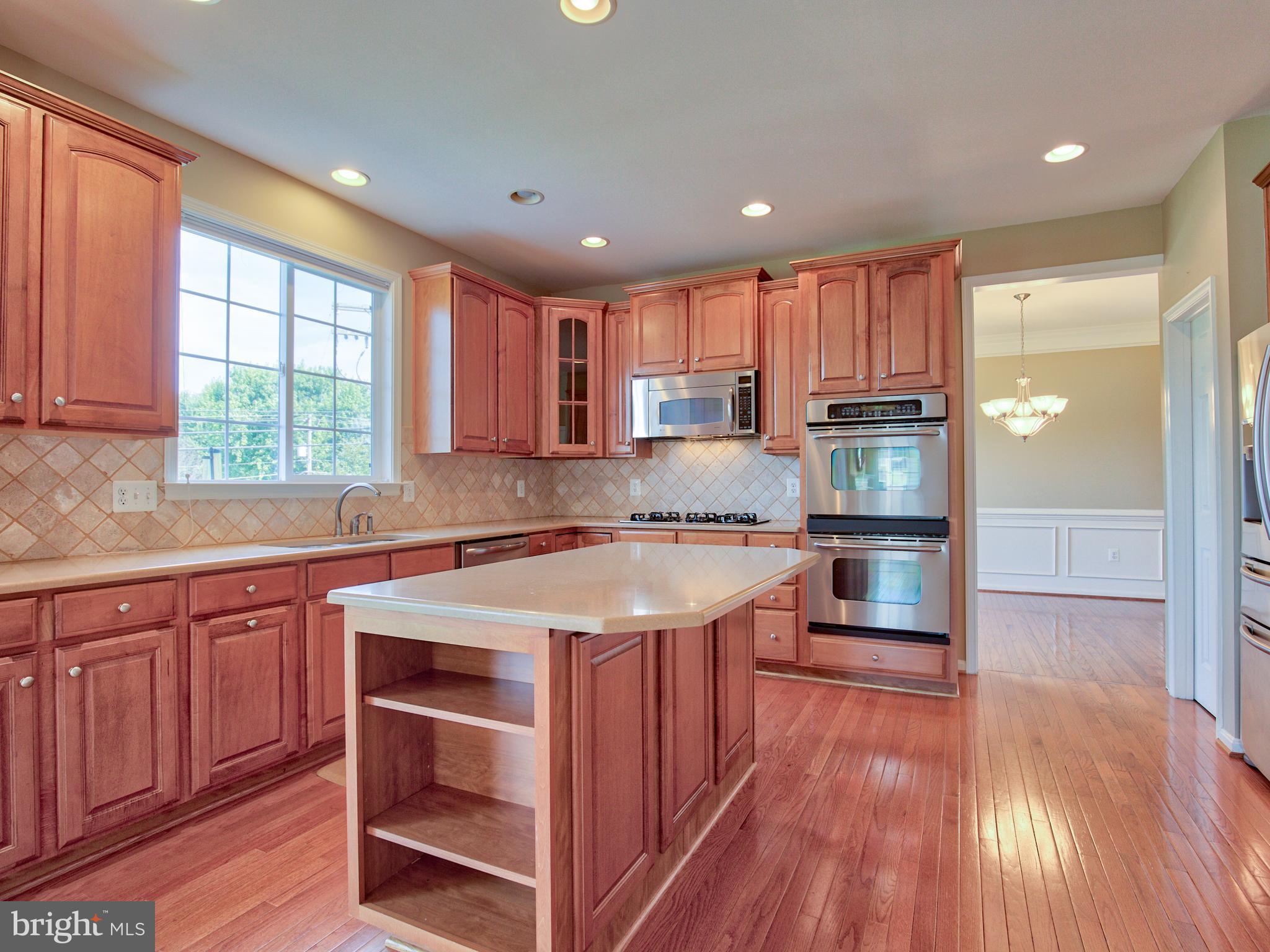 2801 Ridgetop Court Winchester, VA 22601 - Photo 6 of 30 Kitchen w/island & tile backsplash