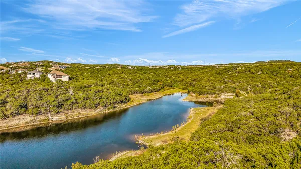 a view of a large body of water with lots of trees