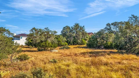 a view of yard covered with snow in front of house