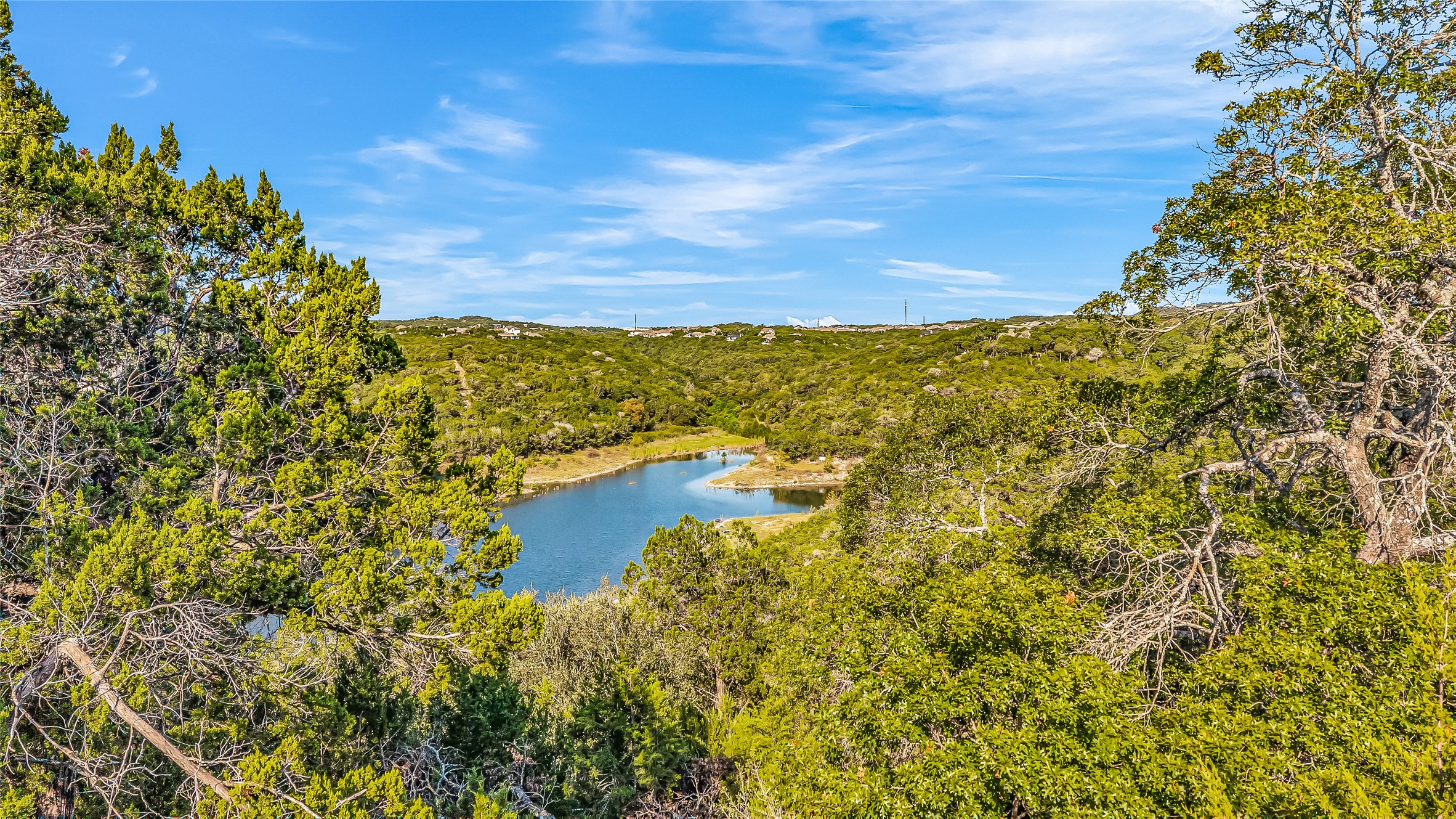7216 Getaway Drive Jonestown, TX 78645 - Photo 26 of 30 Water view featuring a heavily wooded area