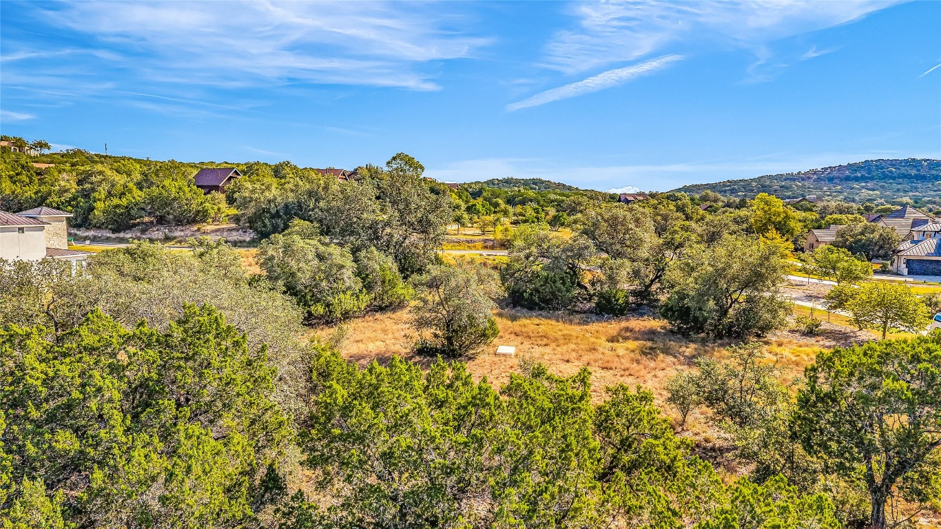 7216 Getaway Drive Jonestown, TX 78645 - Photo 27 of 30 a view of a large building with mountains in the background