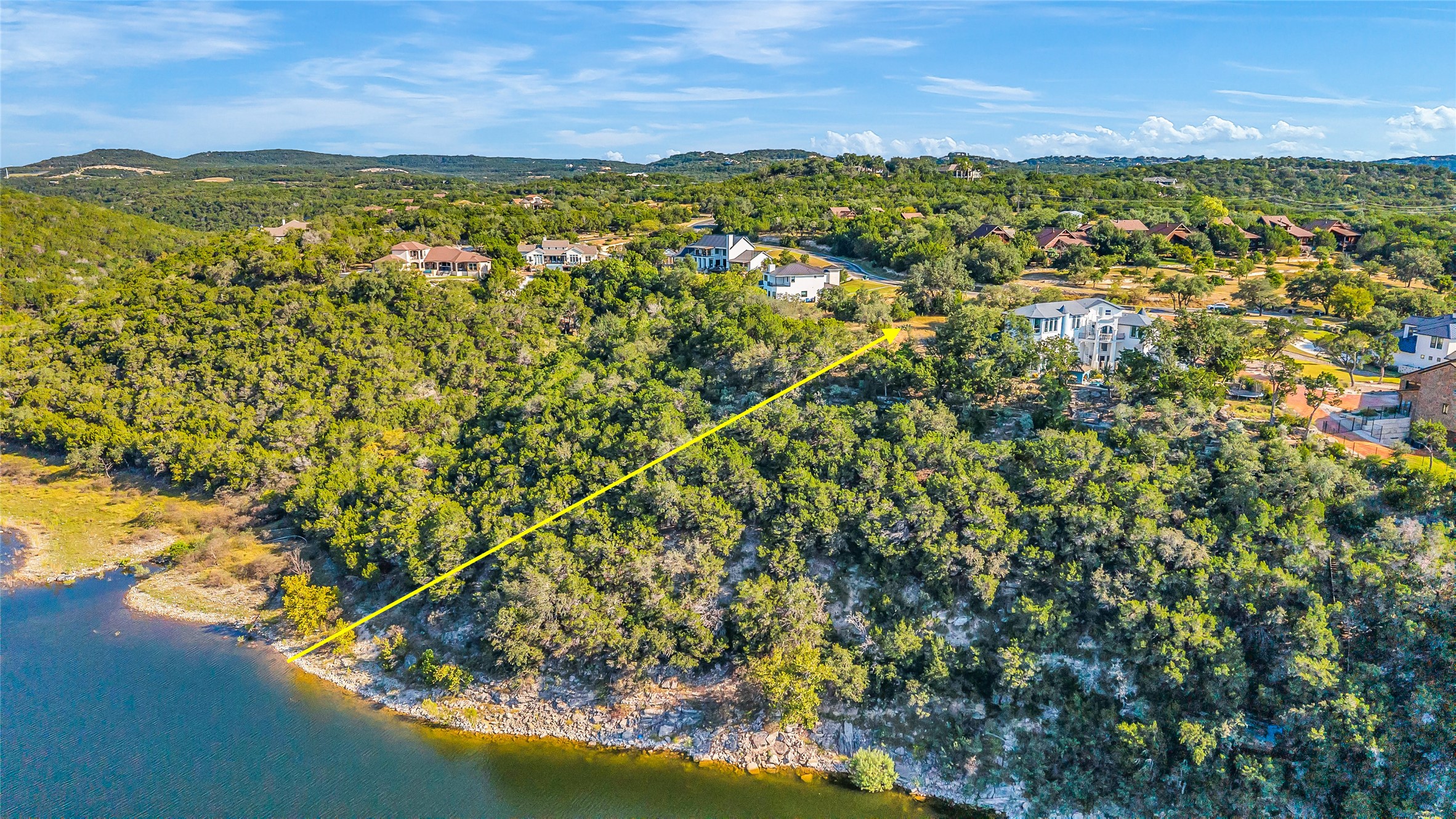 View of property location featuring property boundaries highlighted and a nearby body of water