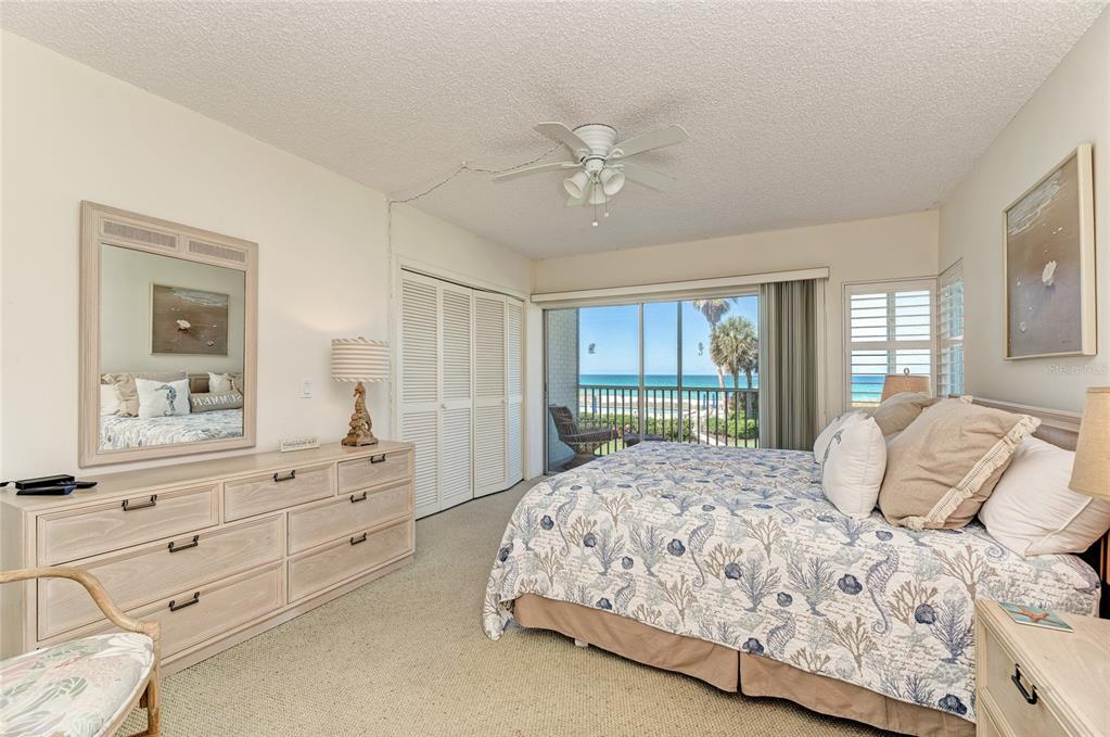 4825 Gulf Of Mexico Drive, Unit 201 Longboat Key, FL 34228 - Photo 11 of 42 a bedroom with a large bed and a window