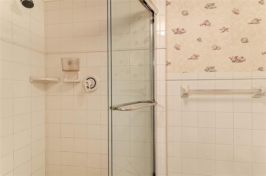 4825 Gulf Of Mexico Drive, Unit 201 Longboat Key, FL 34228 - Photo 15 of 42 a bathroom with a shower