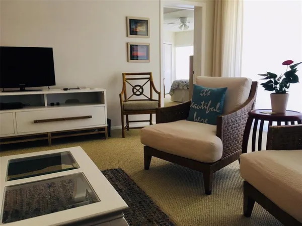 a view of a dining room with furniture and window
