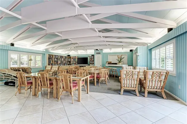 a view of a backyard with sitting area