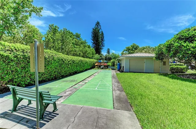 a view of a swimming pool with chairs