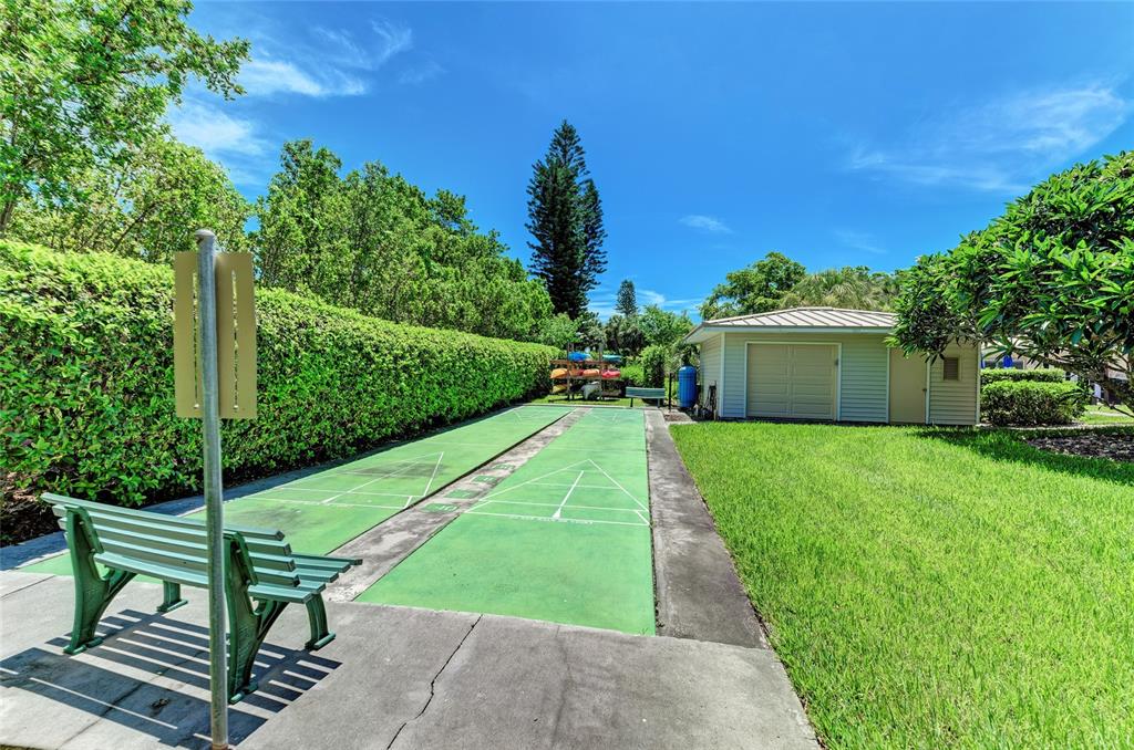 4825 Gulf Of Mexico Drive, Unit 201 Longboat Key, FL 34228 - Photo 35 of 42 a view of a garden with plants