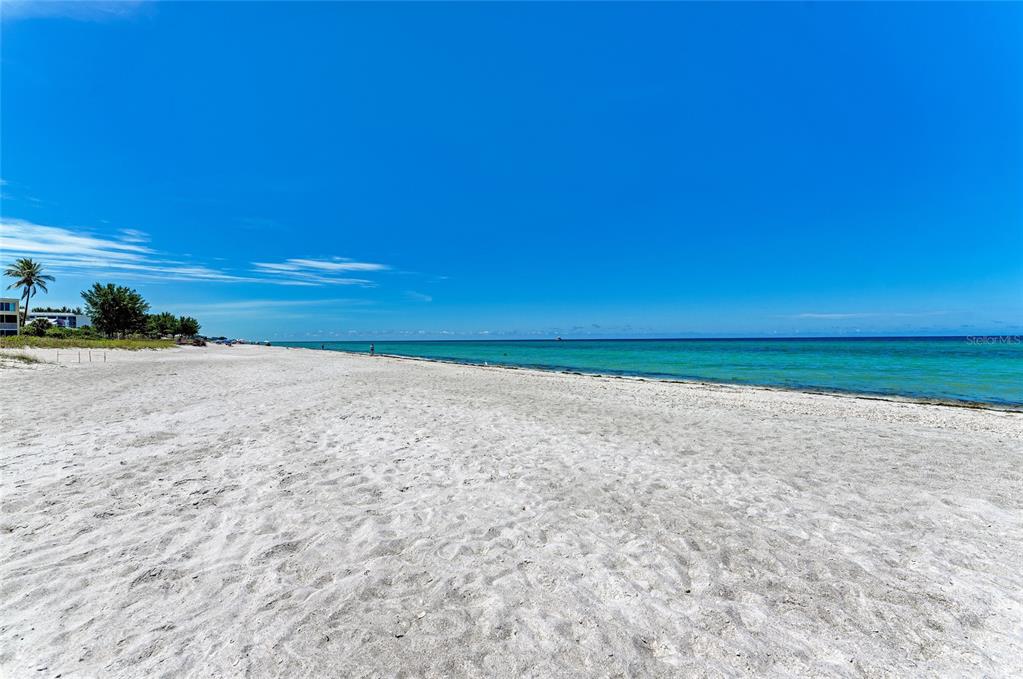 4825 Gulf Of Mexico Drive, Unit 201 Longboat Key, FL 34228 - Photo 40 of 42 a view of empty room with wooden floor and fan