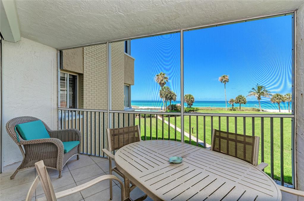 4825 Gulf Of Mexico Drive, Unit 201 Longboat Key, FL 34228 - Photo 9 of 42 a view of a balcony with furniture