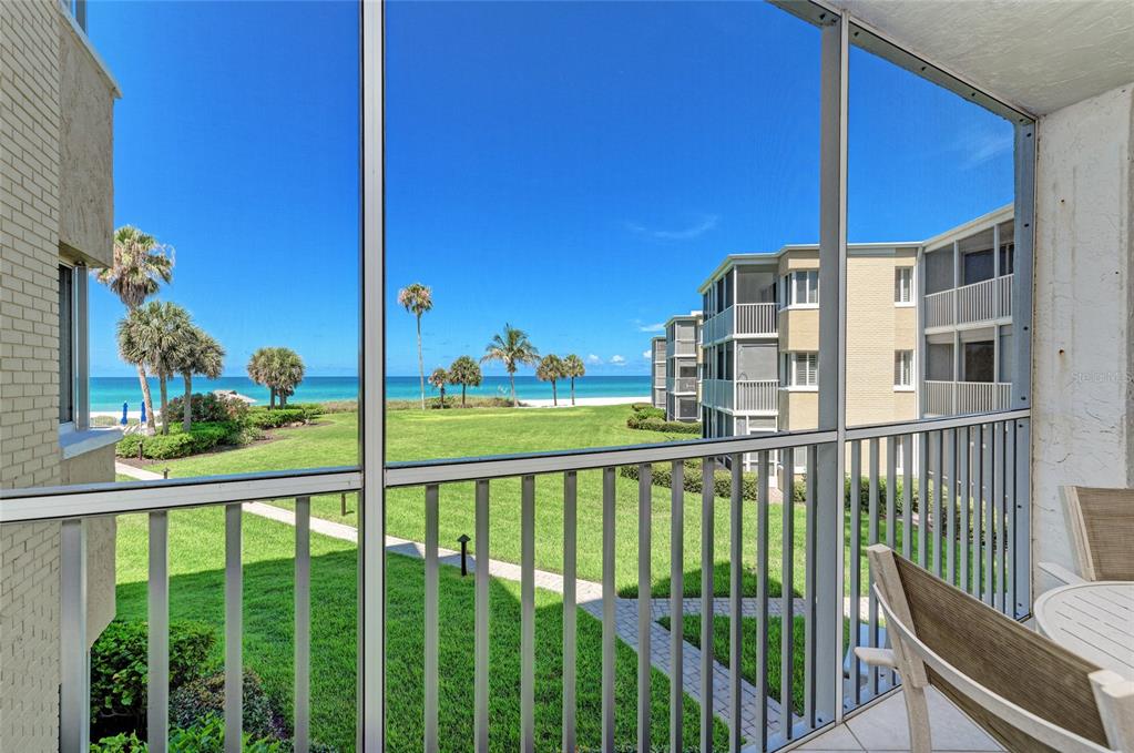 4825 Gulf Of Mexico Drive, Unit 201 Longboat Key, FL 34228 - Photo 10 of 42 a view of a building from a balcony