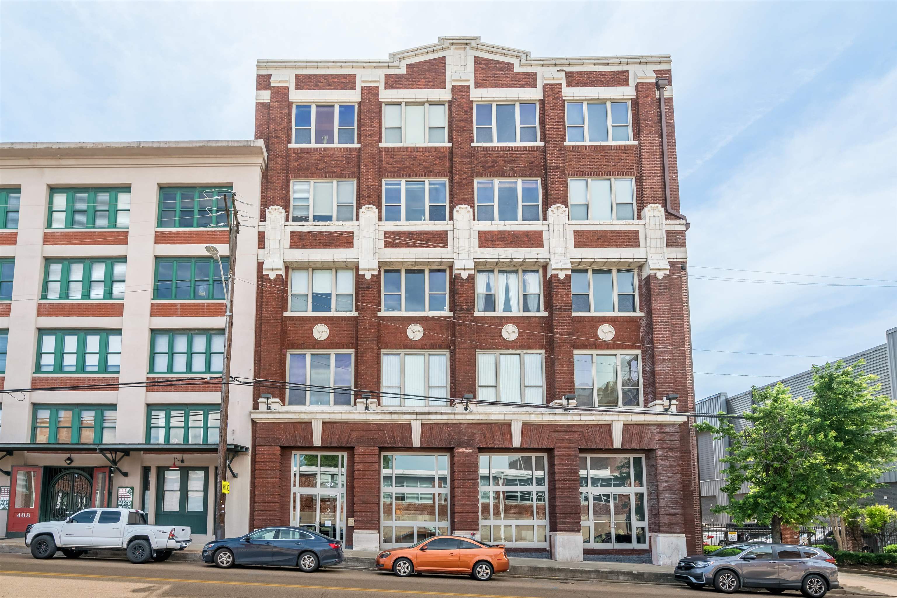 420 South Front Street, Unit 104 Memphis, TN 38103 - Photo 2 of 25 a front view of a building with lot of windows