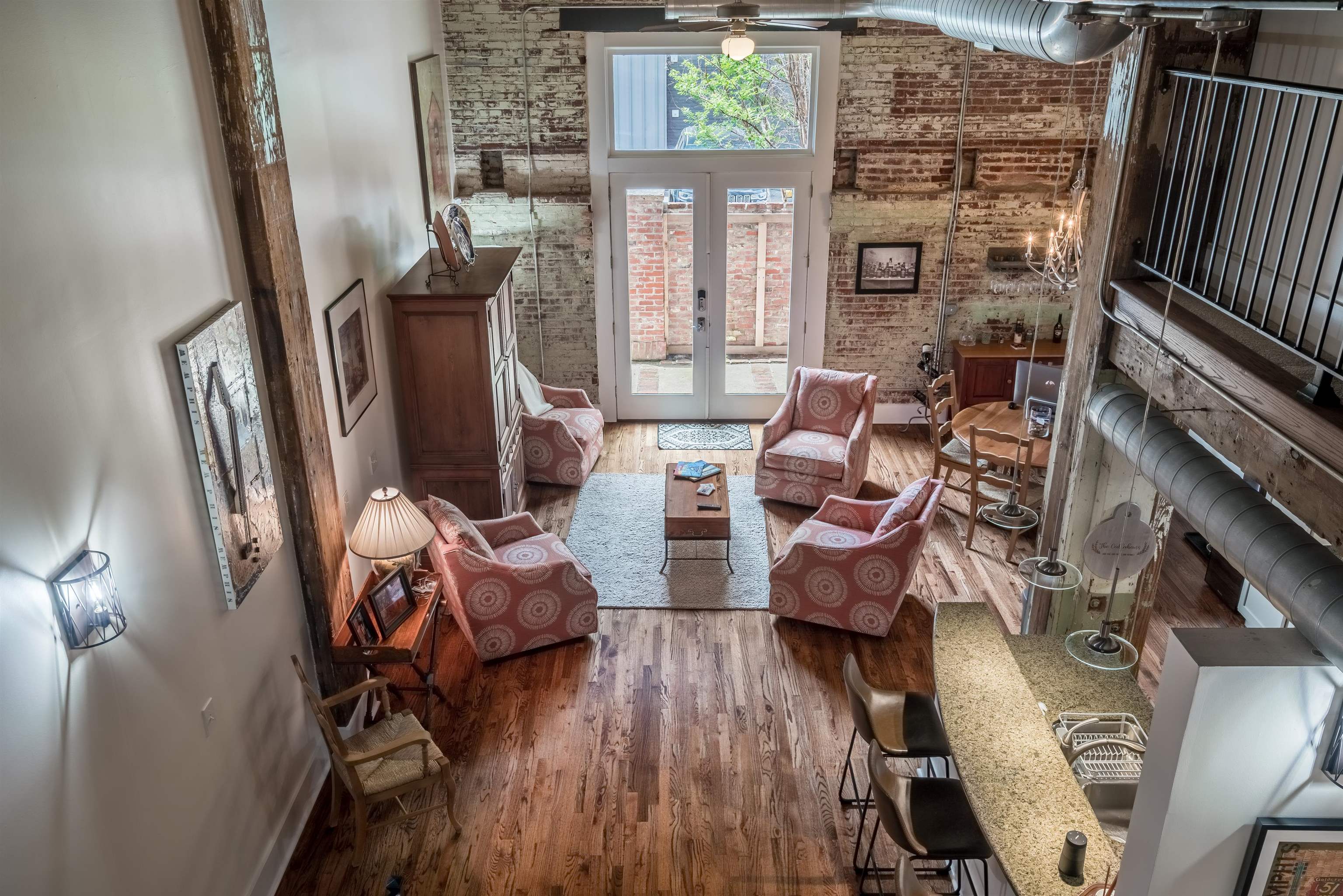 420 South Front Street, Unit 104 Memphis, TN 38103 - Photo 4 of 25 a balcony with furniture and wooden floor