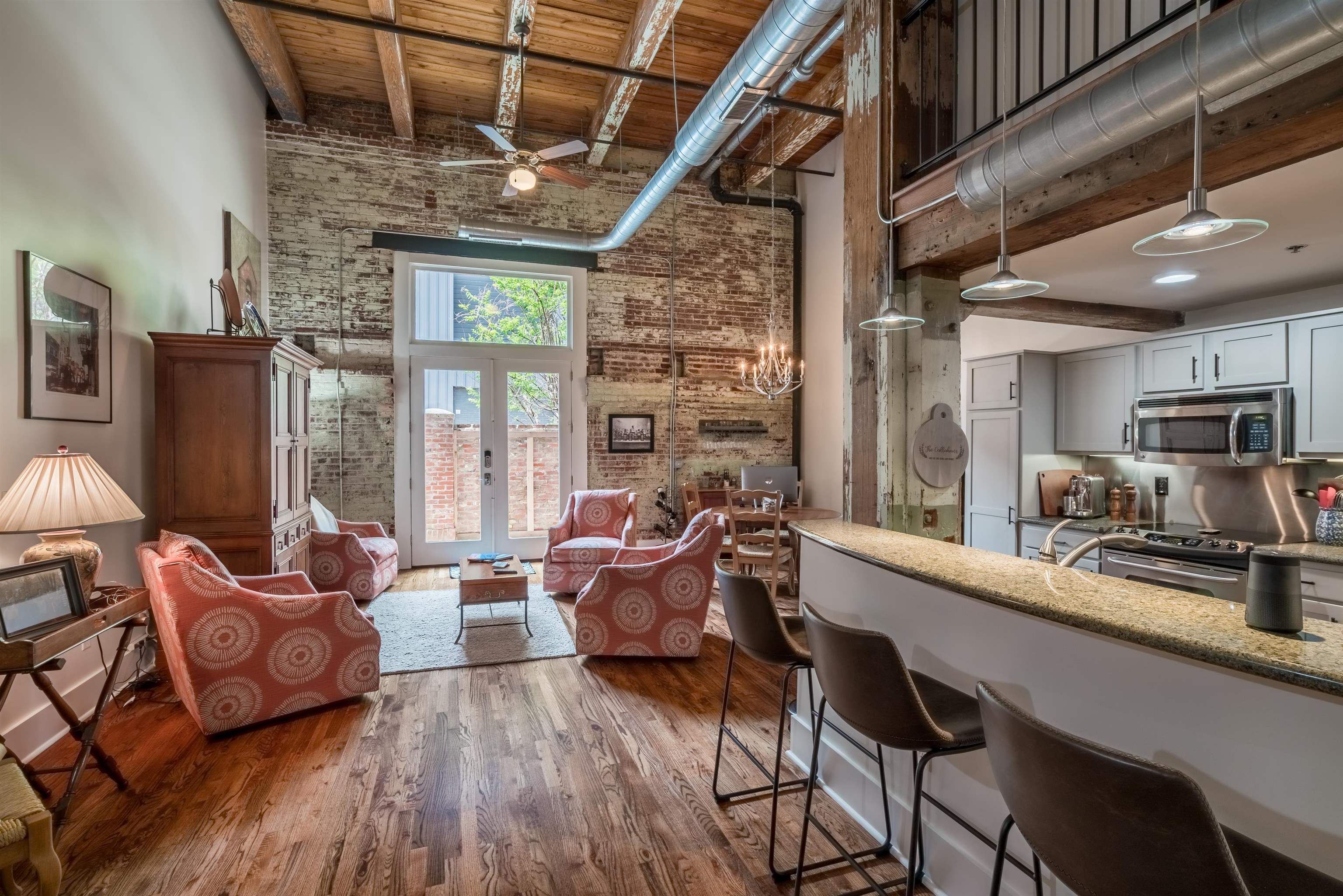 420 South Front Street, Unit 104 Memphis, TN 38103 - Photo 7 of 25 a living room with furniture and a large window