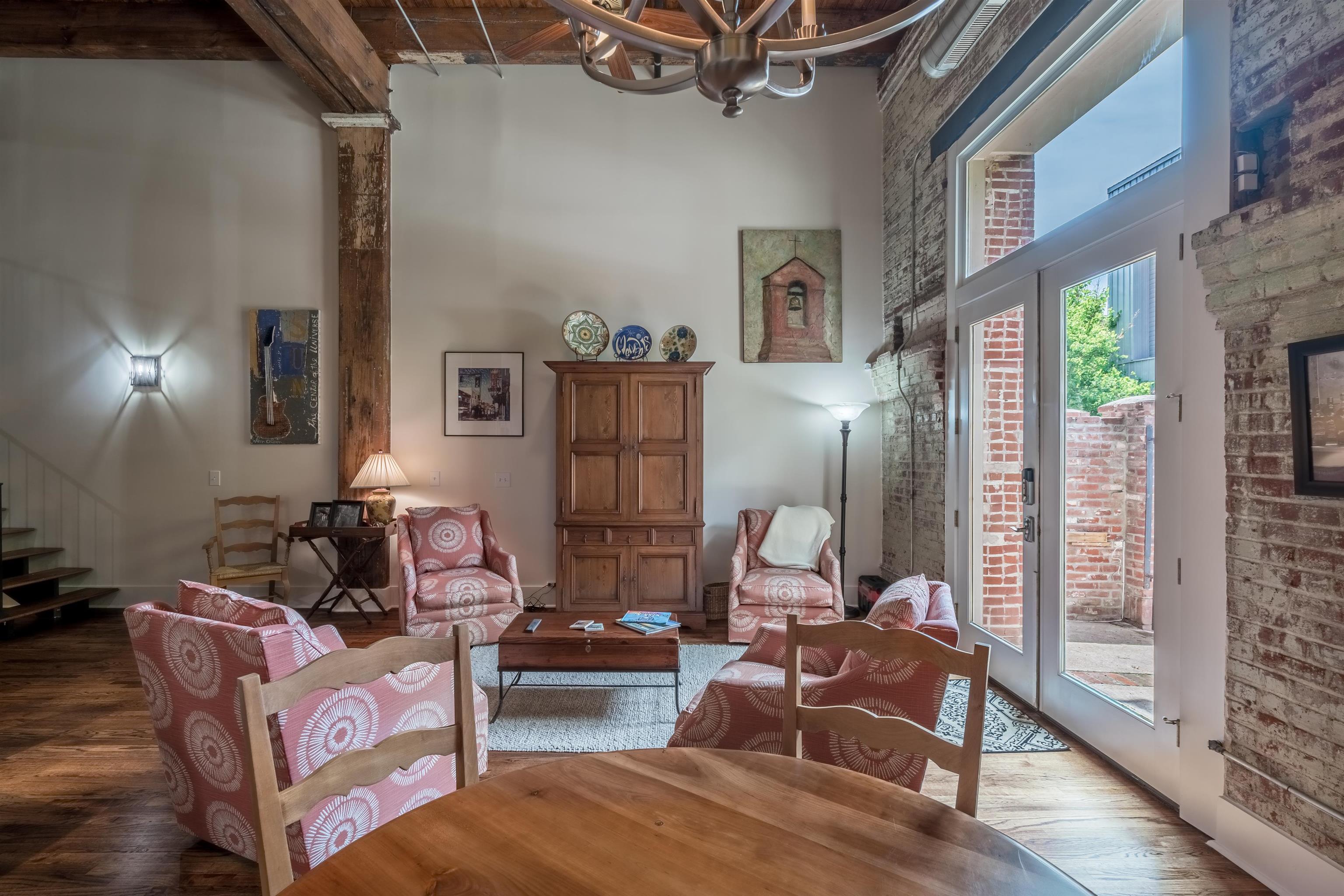 420 South Front Street, Unit 104 Memphis, TN 38103 - Photo 9 of 25 a living room with furniture and a floor to ceiling window