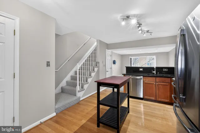 a view of kitchen with sink and dining room