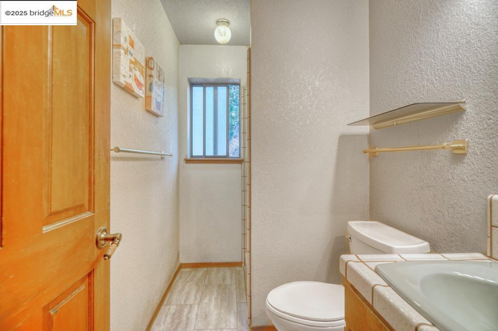 19195 Ferretti Road Groveland, CA 95321 - Photo 19 of 51 Bathroom featuring a textured wall and vanity