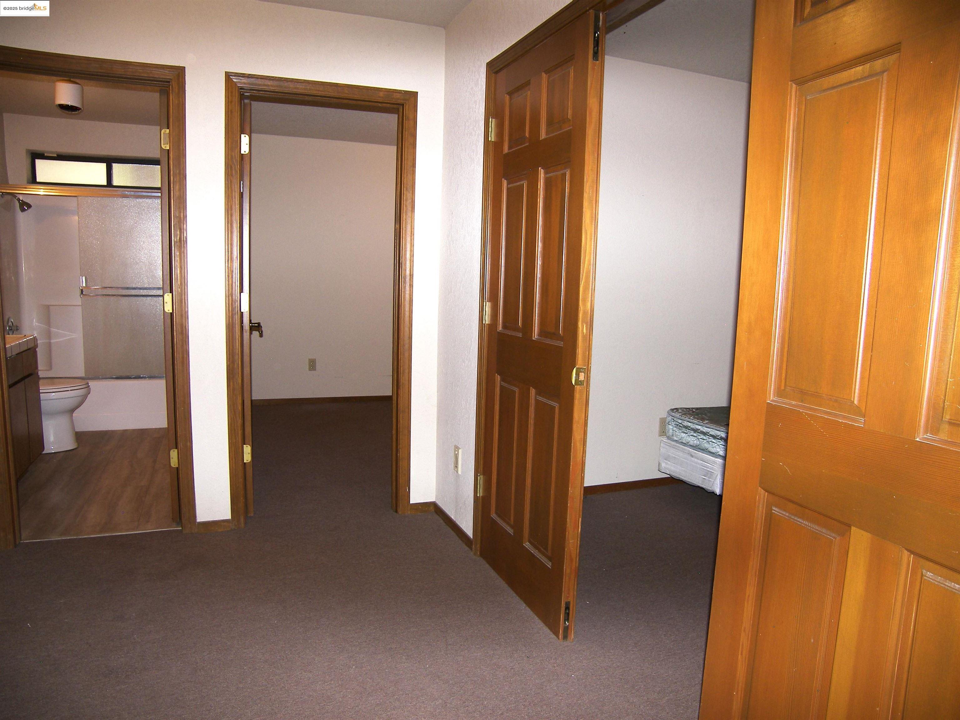 19195 Ferretti Road Groveland, CA 95321 - Photo 22 of 51 Hall with dark carpet and baseboards