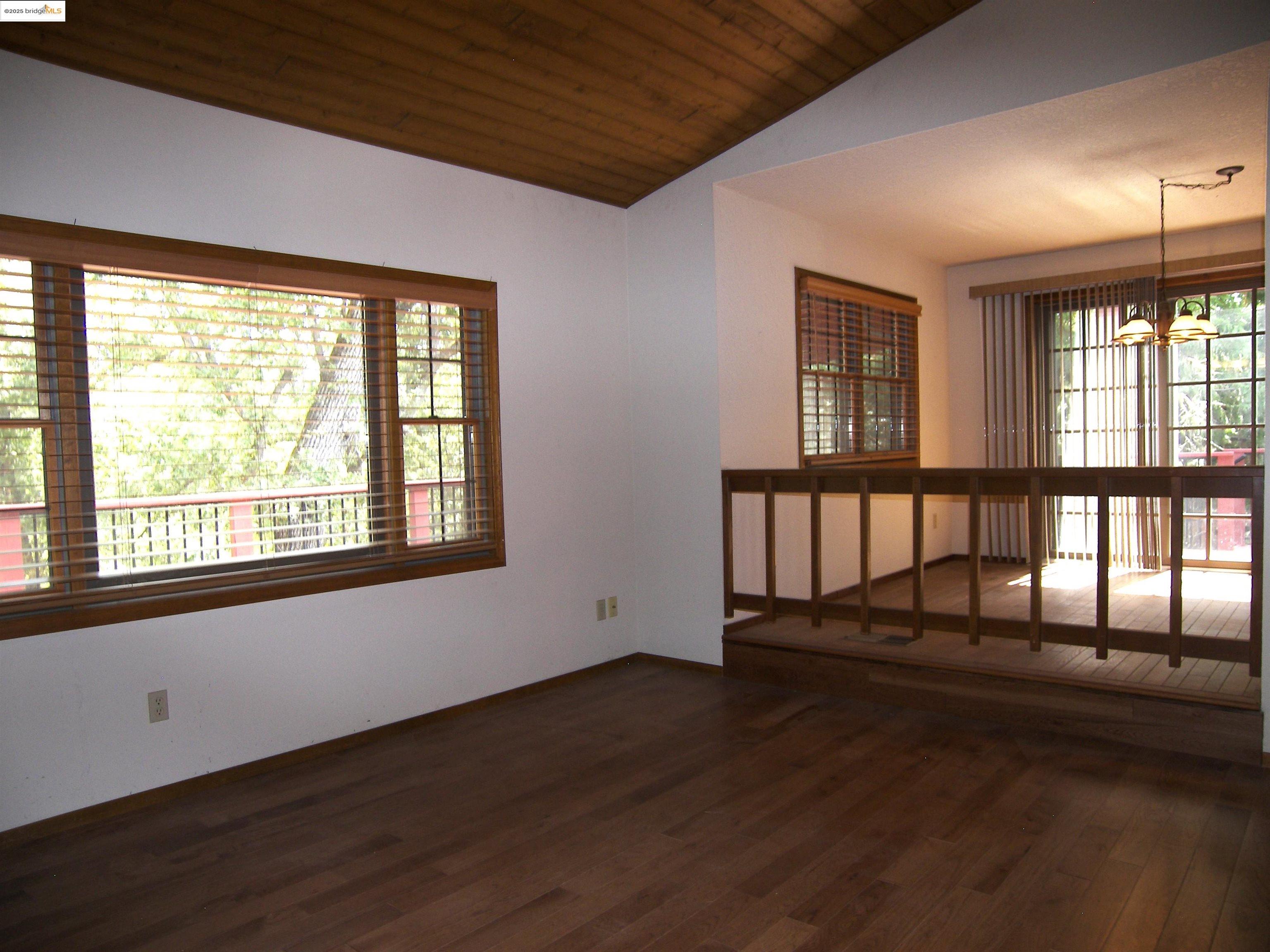 19195 Ferretti Road Groveland, CA 95321 - Photo 46 of 51 a view of an empty room with wooden floor and a window