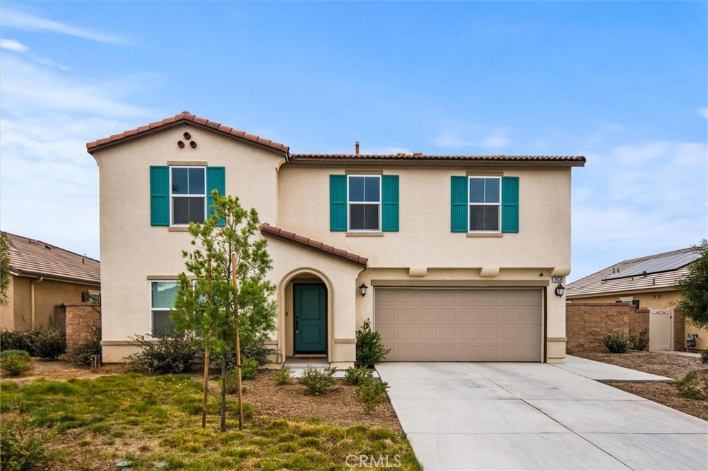 a front view of a house with yard