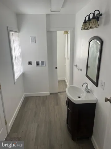 a bathroom with a sink and mirror