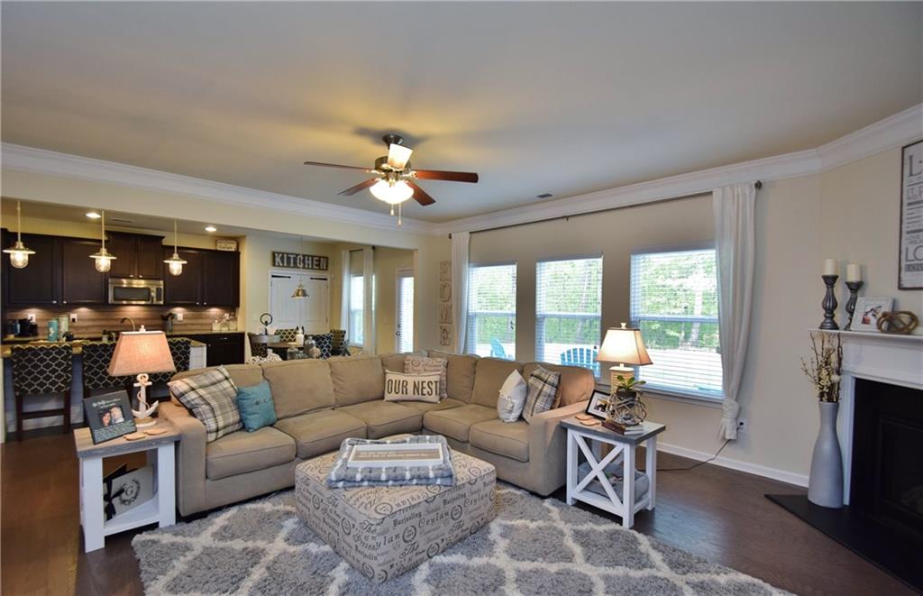 3767 Ridge Bluff Overlook Gainesville, GA 30507 - Photo 1 of 1 a living room with furniture fireplace and a large window