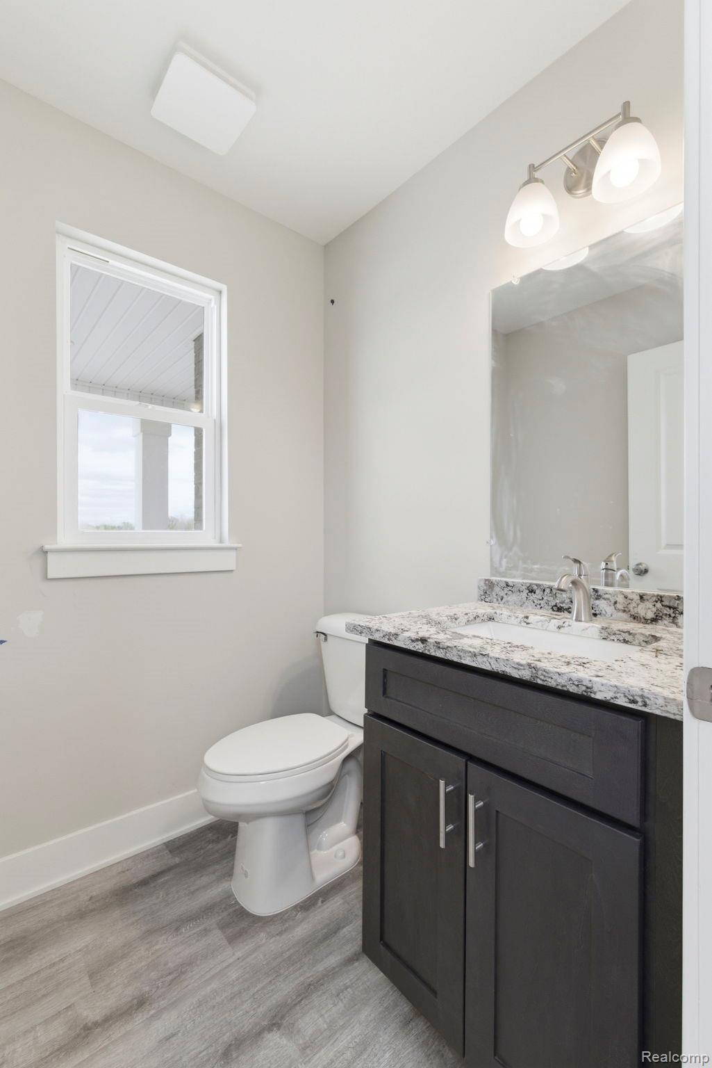2361 Baltimore Davison, MI 48423 - Photo 6 of 31 Bathroom with vanity and light wood-style flooring
