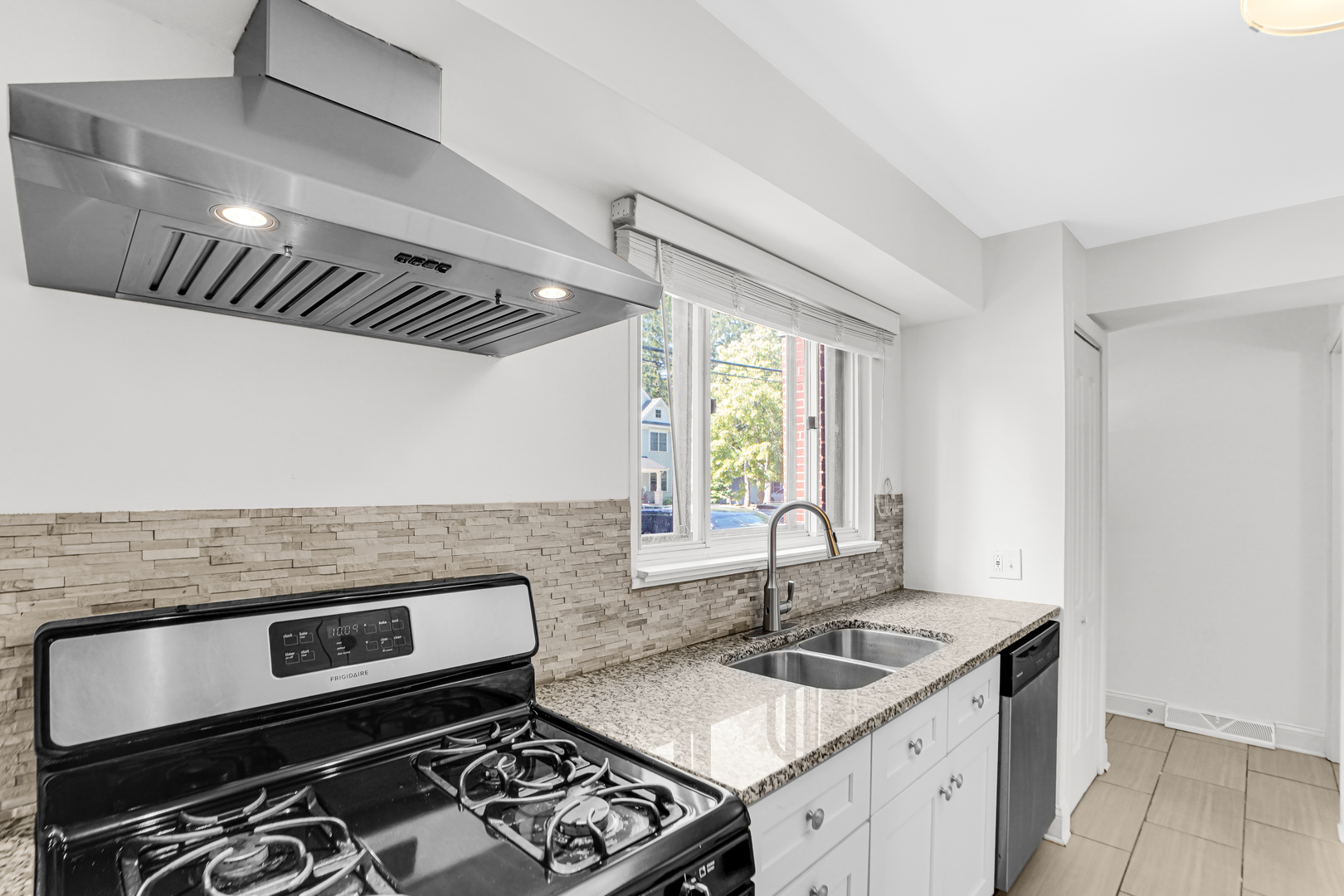 503 Ridge Road, Unit 21 Wilmette, IL 60091 - Photo 14 of 21 a kitchen with granite countertop a stove and a sink