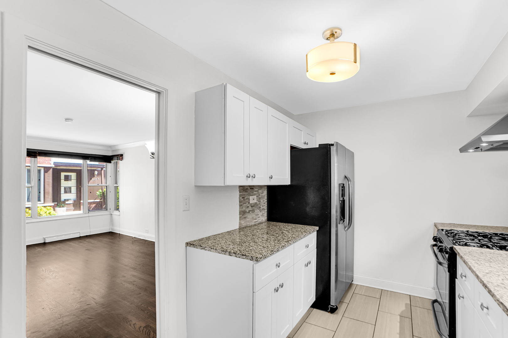 503 Ridge Road, Unit 21 Wilmette, IL 60091 - Photo 18 of 21 a kitchen with a stove and a refrigerator