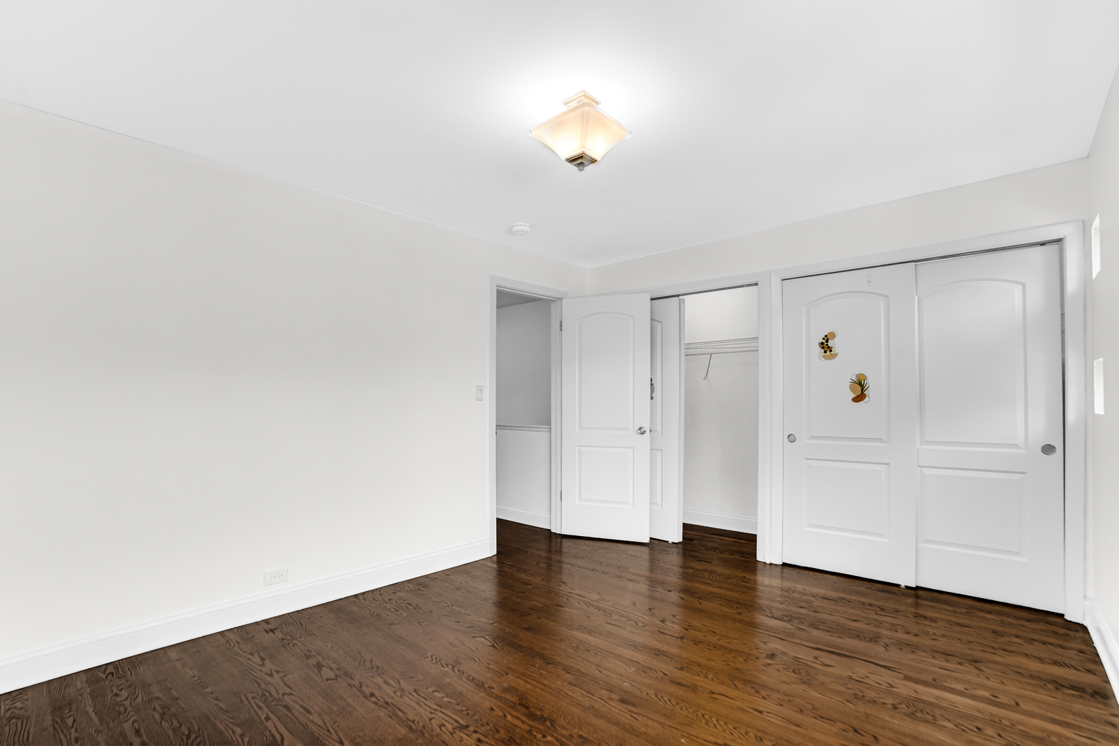 503 Ridge Road, Unit 21 Wilmette, IL 60091 - Photo 7 of 21 a view of an empty room with wooden floor and white walls