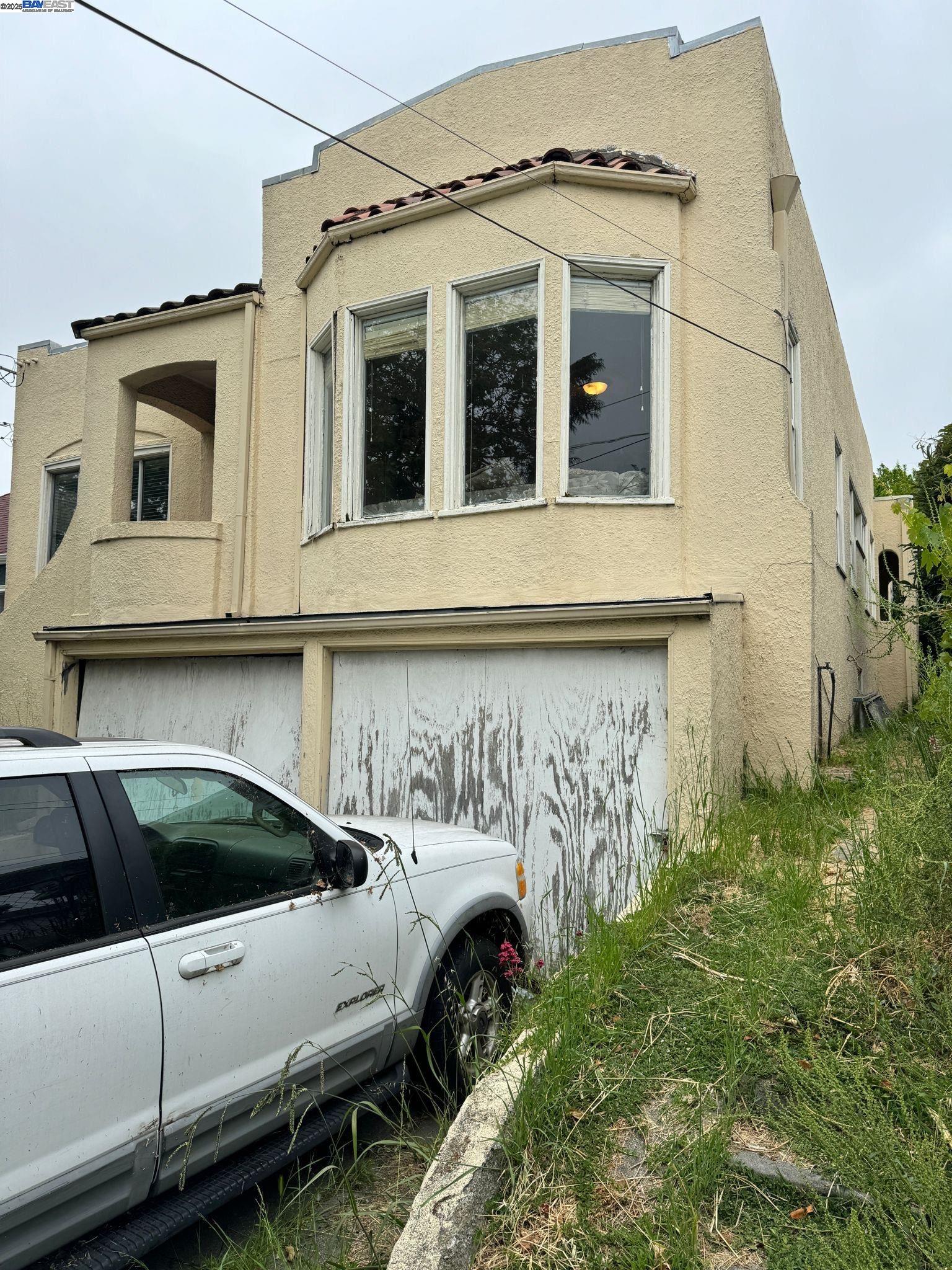 2123 High Street Oakland, CA 94601 - Photo 4 of 14 a view of a white house with large windows