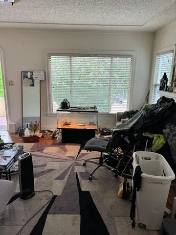 a room with gym equipment and a large window