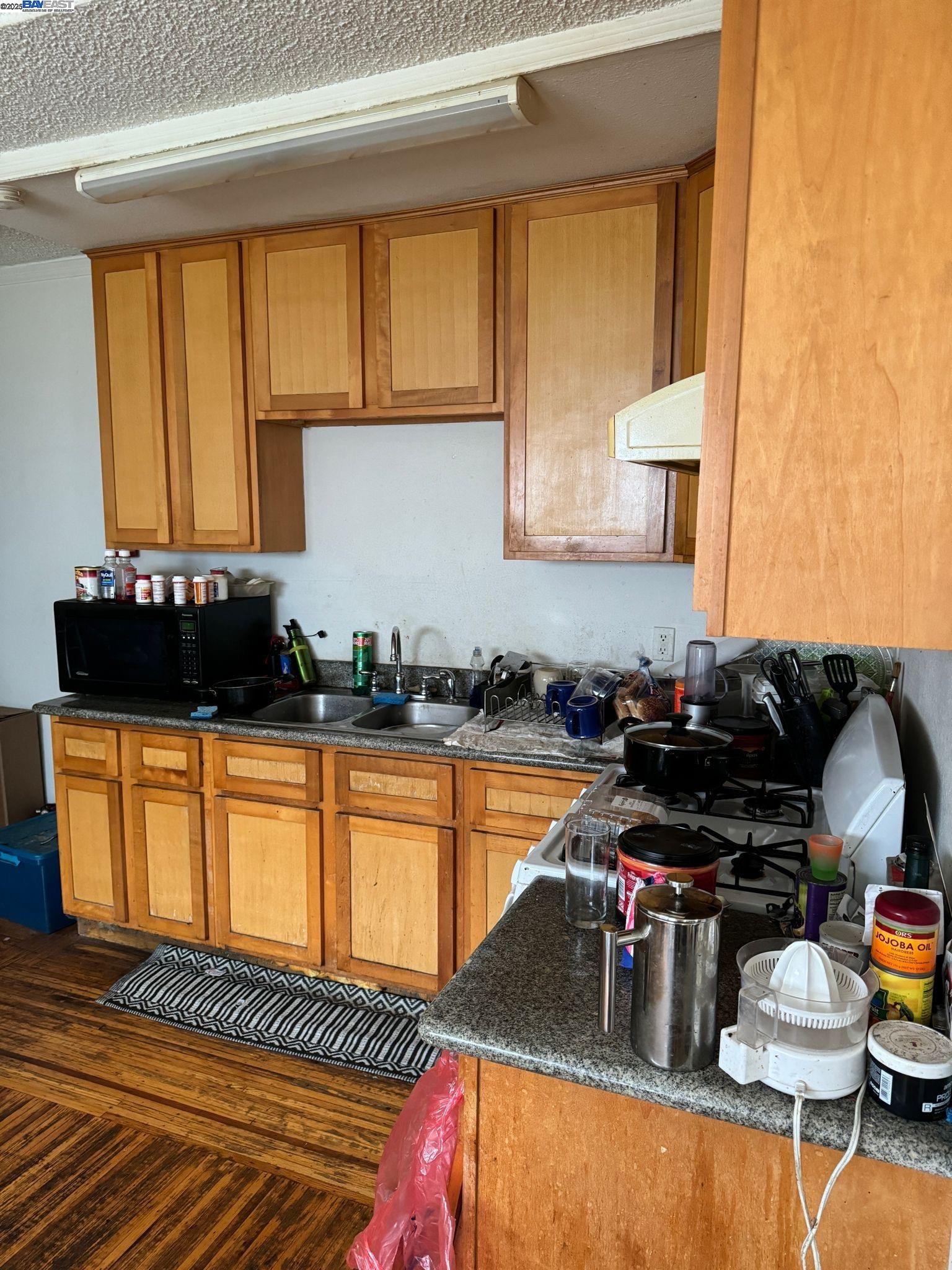 2123 High Street Oakland, CA 94601 - Photo 9 of 14 a kitchen with a sink and a stove top open