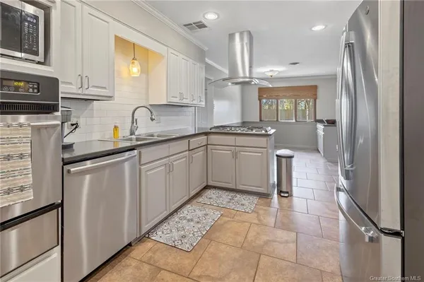 $257,500 | 1619 South Whispering Woods Drive, Lake Charles, LA 70605