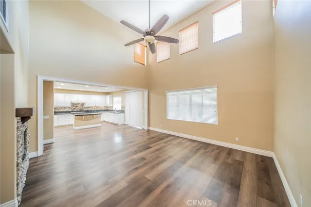 a kitchen with a refrigerator and a stove top oven