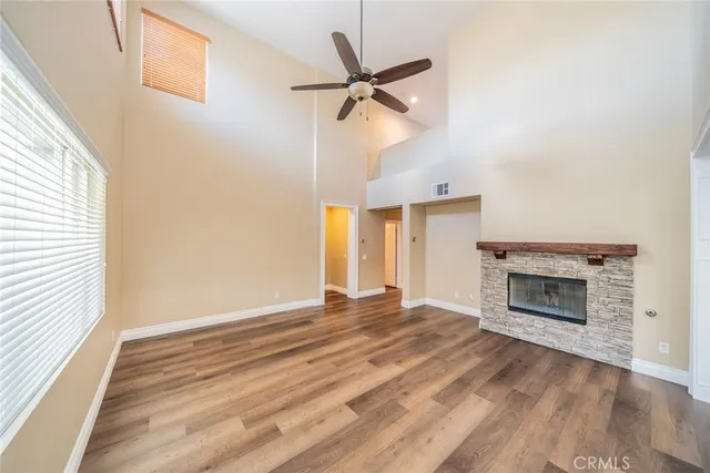 a kitchen with granite countertop white cabinets and stainless steel appliances