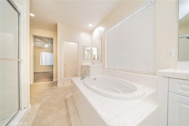 a white toilet sitting next to a bath tub