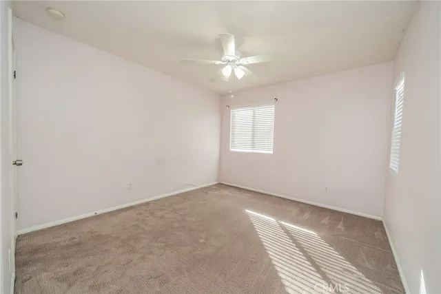 an aerial view of a house with a garden and lake view