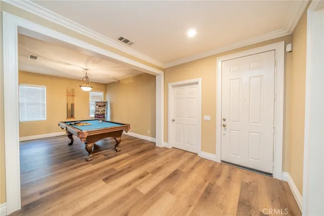 a living room with a table and a rug