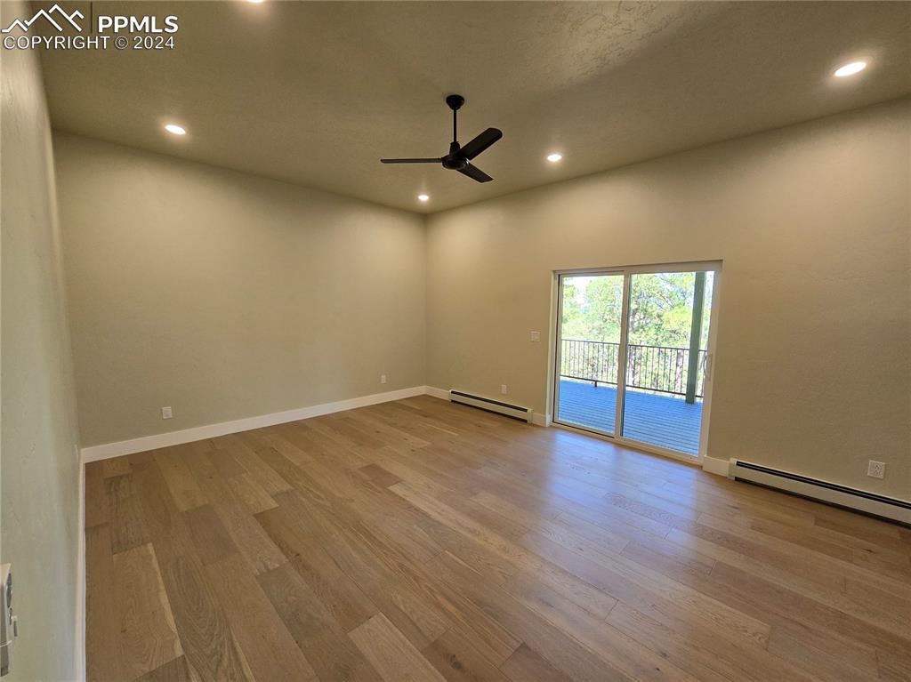 33036 Meadow Ridge Lane Trinidad, CO 81082 - Photo 33 of 50 an empty room with wooden floor and windows