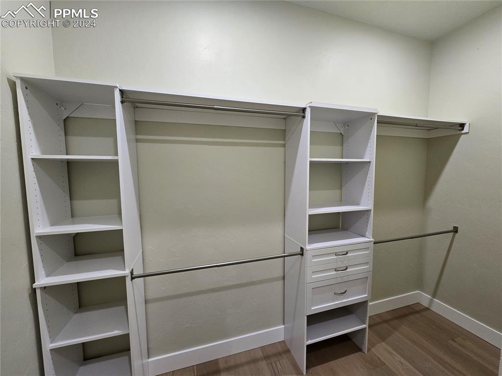 33036 Meadow Ridge Lane Trinidad, CO 81082 - Photo 34 of 50 a room with walk in closet and wooden floor