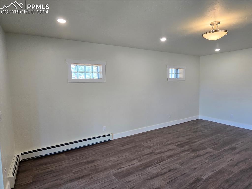 33036 Meadow Ridge Lane Trinidad, CO 81082 - Photo 44 of 50 an empty room with wooden floor and windows