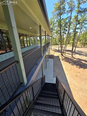 a view of a balcony with wooden floor